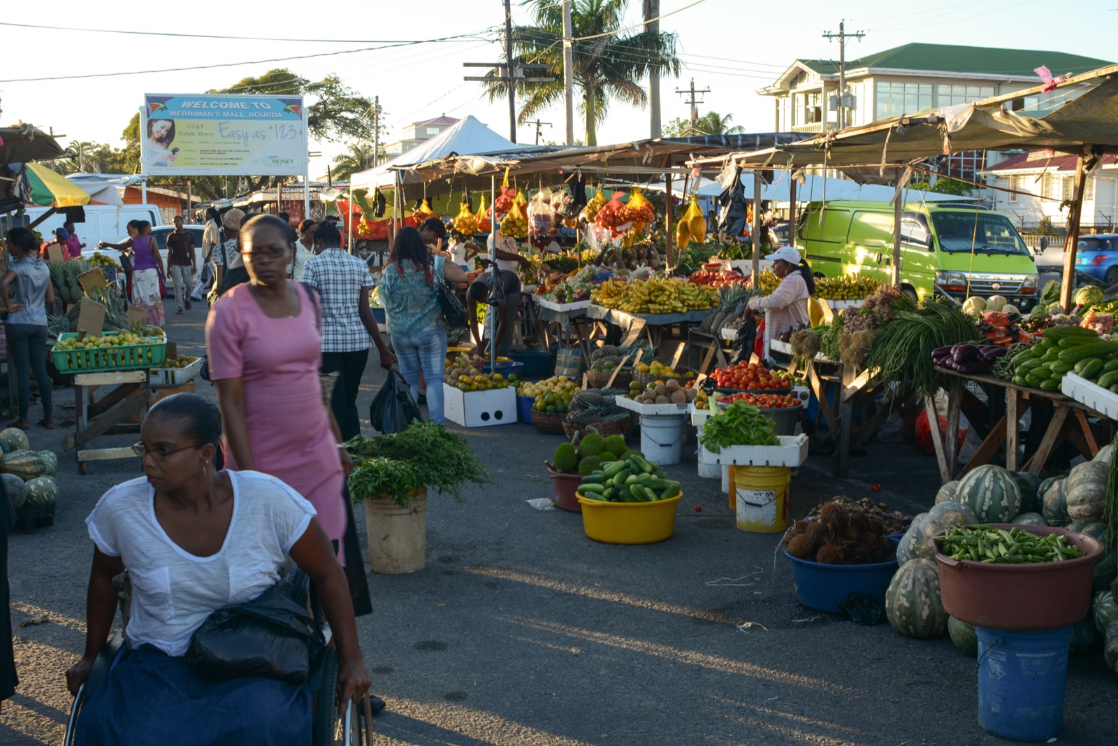 Bourda Market, Georgetown, bustling with vendors and shoppers at golden hour