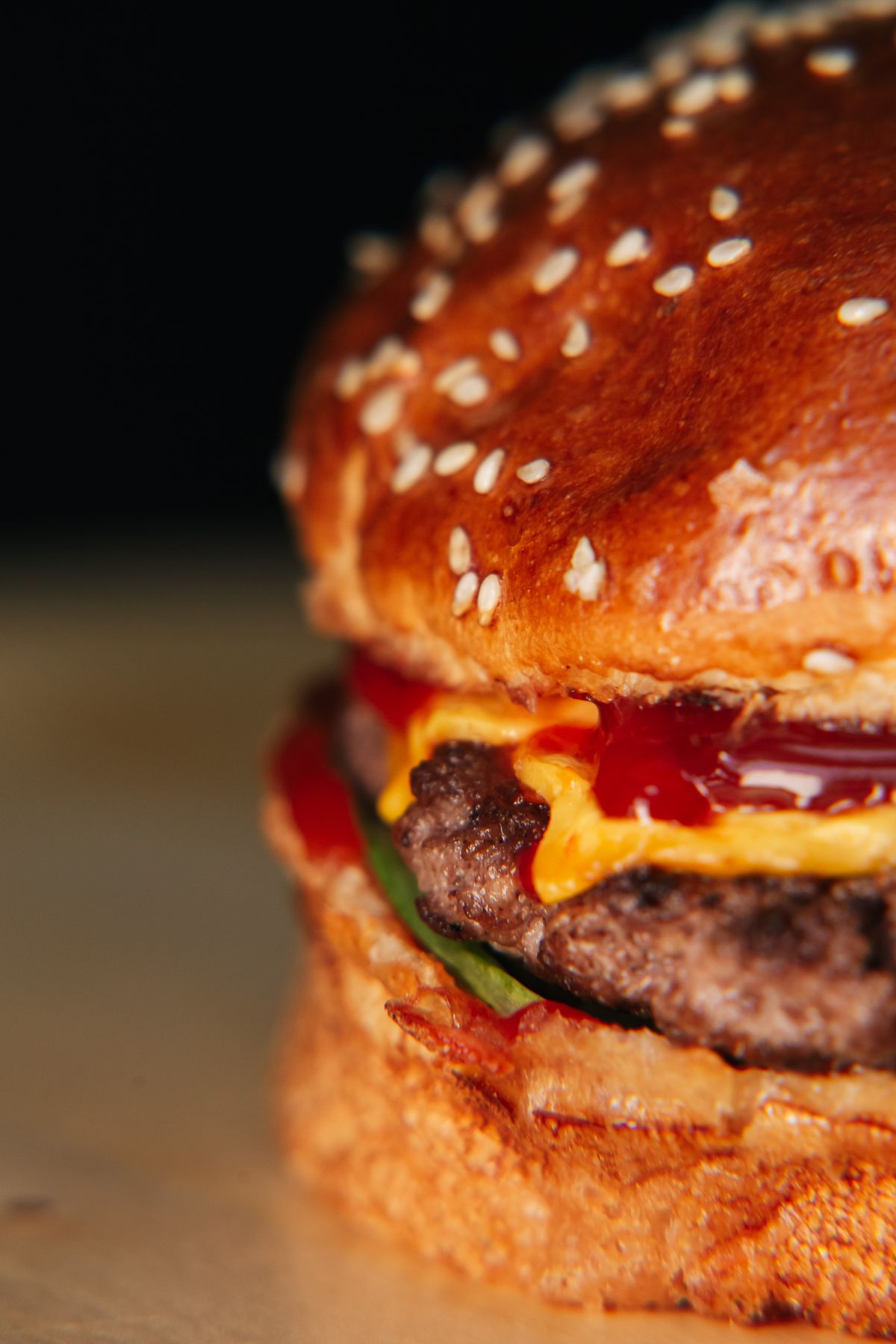 Close-up of a stacked burger with melted cheese